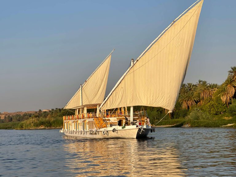 View from the front a dahabiya sailing in the middle of the Nile River in Aswan, Egypt