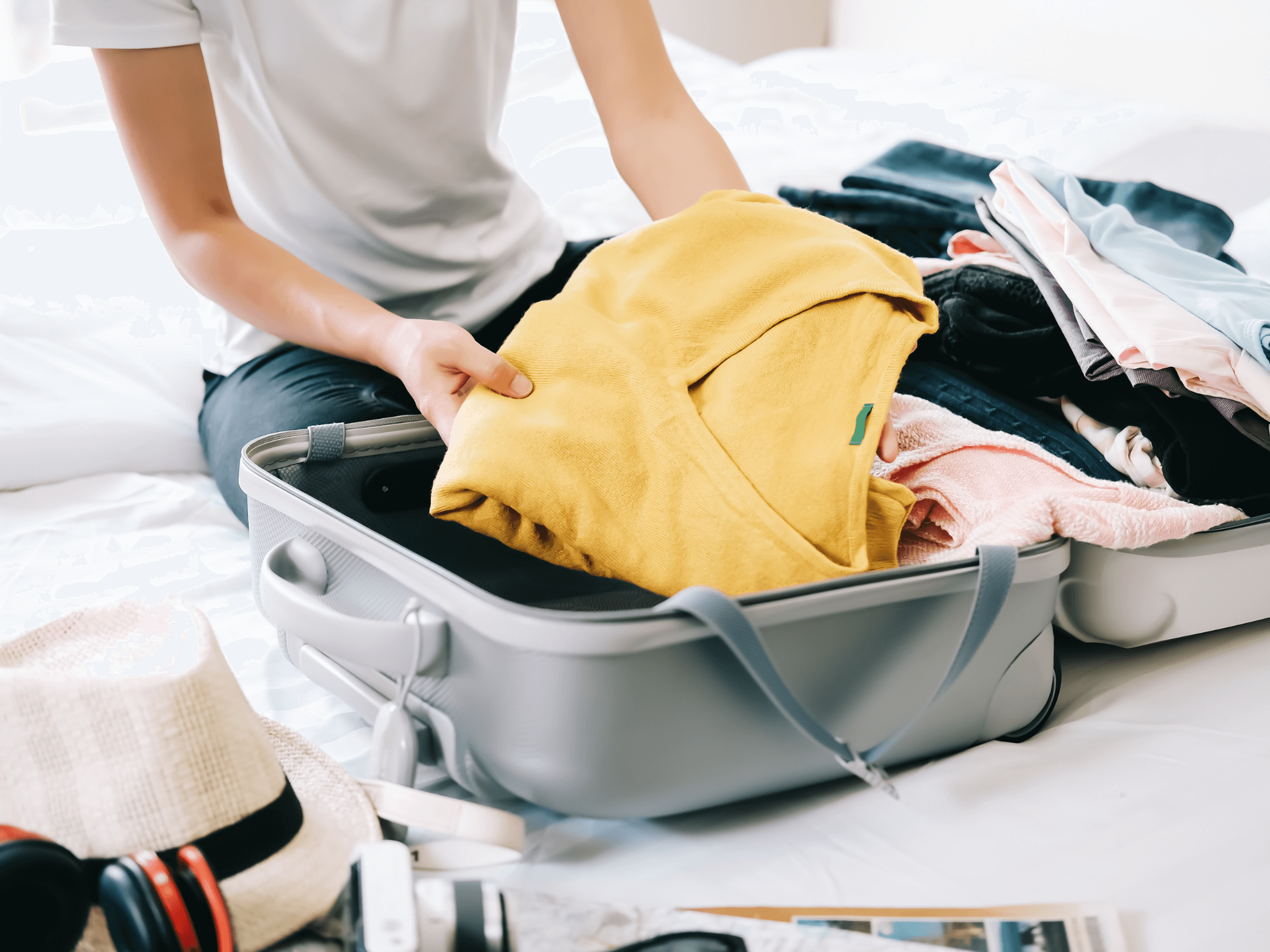a traveler preparing her travel baggage
