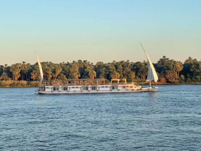 The dahabiya Safiya sailing peacefully along the Nile River in Aswan