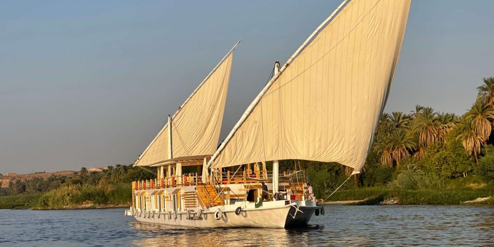 View from the front a dahabiya sailing in the middle of the Nile River in Aswan, Egypt